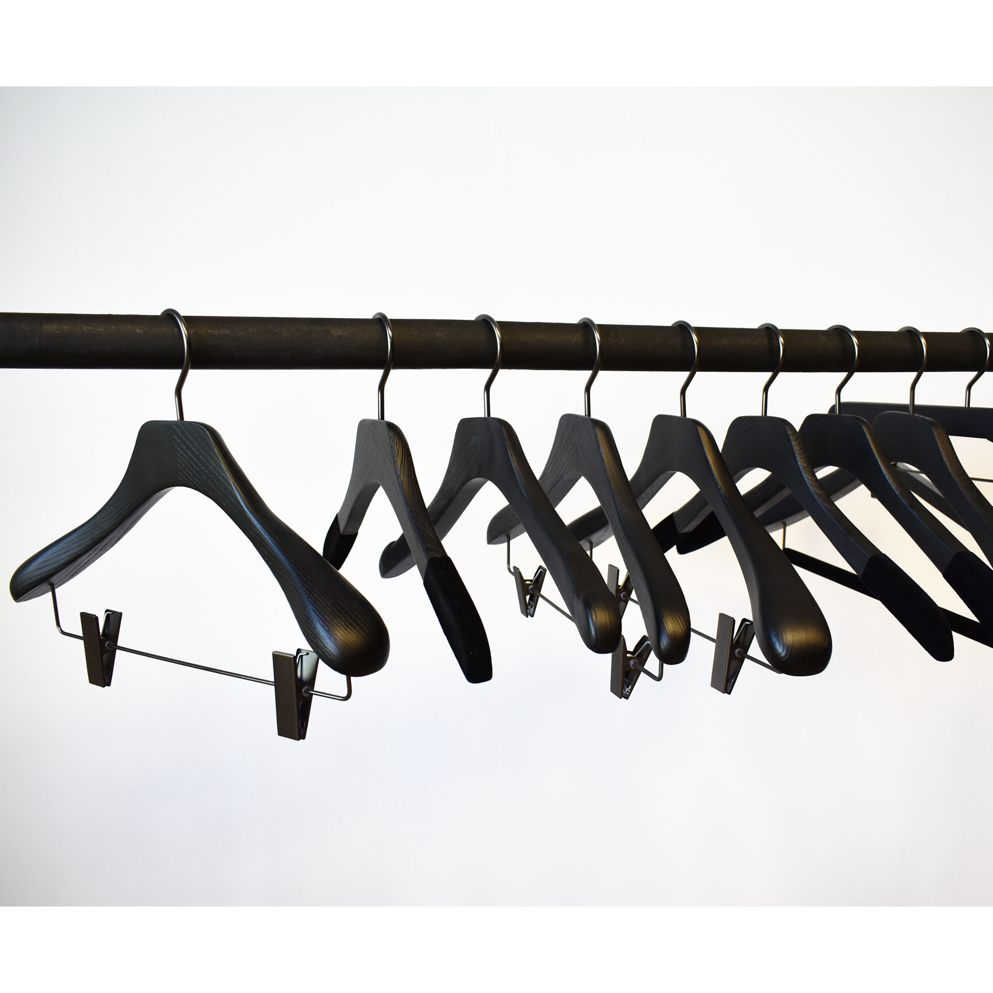 Black wooden hangers with clips for jacket and suit
