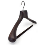 Coat and suit hanger with wide shoulders and anti-slip bar