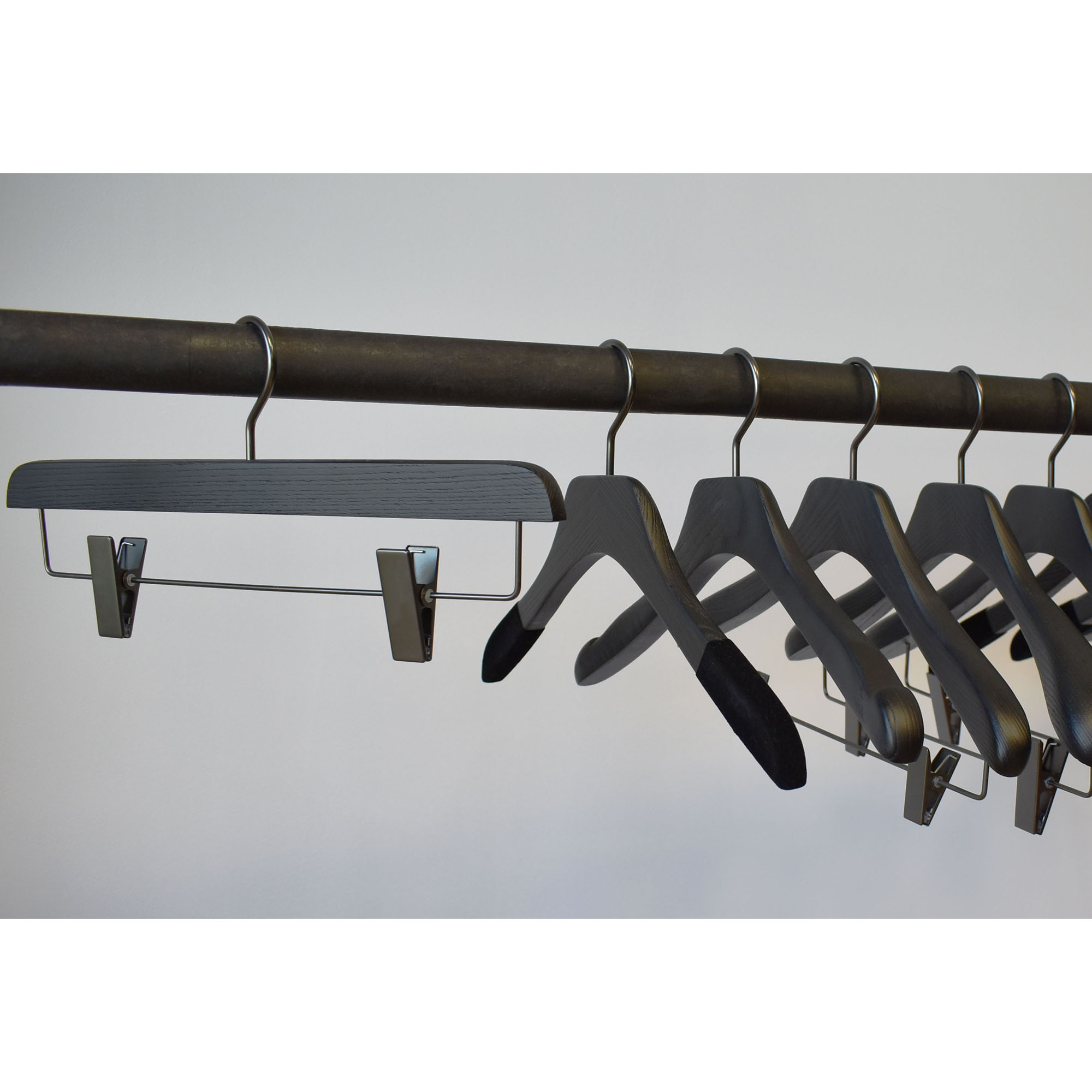 black wooden hangers with clips for skirt and pants