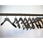 Black wooden hangers for shirts and t-shirts with non-slip velvet on the shoulders