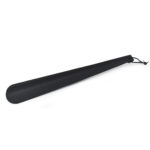 Large shoe horn covered in carbon fiber leather